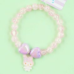 Add this kawaii bracelet to your collection! It’s made from transparent purple plastic beads and two heart-shaped beads in a matching color. This special bracelet comes with a cute My Melody charm. Total length: 17 cm Cutecore Accessories, Fairy Kei Accessories, Cute My Melody, Kawaii Bracelet, Kandi Inspo, Kandi Cuff, Pink Stuff, Kandi Bracelets, Kawaii Jewelry