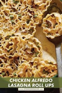 chicken alfredo lasagna roll ups in a green bowl with a spoon on the side