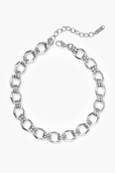 This bold geometric link choker necklace makes a striking statement with its chunky, angular chain link design. A modern silhouette with polished finishing creates an eye-catching moment that elevates any look with confidence and edge. - Stainless steel base - Length: 13" / 330.2mm + 3" / 76.2mm extender (adjustable)- Width: 0.55" / 14mm- Lobster clasp- Available in gold + silver - Engraved with signature MC branding- Hypoallergenic, non-tarnish, water-resistant Modern Metal Chain Necklace With Chunky Chain, Modern Metal Chain Necklace With Silver Chain, Modern Silver Chain Metal Necklace, Trendy Metal Chain Necklace With Solid Links, Modern Metal Chain Necklace, Modern Chunky Chain Link Jewelry, Modern Metal Chain Link Necklace, Modern Chunky Chain Necklace, Modern Chunky Link Jewelry