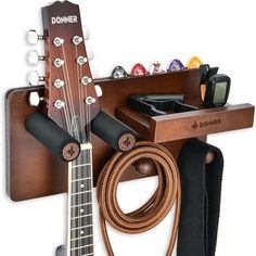 a guitar and other musical instruments are on display with the cord attached to it's neck