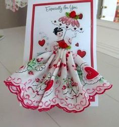 a handmade card with an image of a woman in a dress and hearts on it