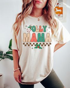 This Comfort Colors T-shirt features a trendy, retro style Jolly Mama design and would make the perfect graphic tee to wear doing all your Christmas activities.  Comes in multiple colors! ✨️SIZE AND FIT: Your shirt will be printed on a high-quality, soft and comfortable unisex t-shirt. Sizes run true to size, which takes the guesswork out of ordering. If you like your t-shirts loose or oversized - size up. For a more fitted women's style - size down. If you are looking for the 'shirt dress' look Retro Christmas Shirt, Womens Christmas Shirts, Christmas Tshirt, Mama Shirt, Retro Christmas, Christmas Women, Christmas Shirt, Christmas Tshirts, Ugly Christmas