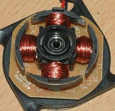 an assortment of different types of wires on top of a piece of metal and wood