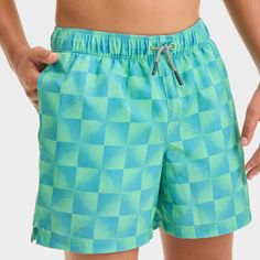 These Checkered Swim Shorts from art class™ bring on-trend flair to your kid's summer wardrobe. Made from 100% recycled polyester twill fabric with built-in boxers for comfortable wear in and out of water, these mid-rise swim shorts feature a UPF 50+ rated material helps protect them from the sun's rays. An adjustable waistband with a front drawstring offers a secure fit, while two side pockets come in handy for stashing small essentials. Featuring a checkered print with each square in ombre hue Boys Swim Shorts, Boys Plaid, Checkered Print, Adjustable Waistband, Twill Fabric, Summer Kids, Art Class, Swim Shorts, Summer Wardrobe