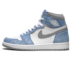 the nike air jordan 1 mid is blue and white with grey accents on the upper