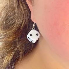 Perfect for gamers and fashion enthusiasts alike!  Our eye-catching Dangle Dice Earrings are crafted from standard-sized white dice, these earrings blend playful charm with a bold statement. Each earring features a single die, showcasing the classic dot design, adding a fun and quirky twist to your accessory collection. The dice drop length is 4 cm and they are securely attached to high-quality metal hooks, ensuring durability and comfort for all-day wear. Whether you're heading to a game night, a casual outing, or looking to add a personality to your everyday style, these earrings will turn heads and spark conversations. Add a roll of the dice to your look with our Dangle Dice Earrings - where fashion meets fun! Card Game Earrings, White Sterling Silver Novelty Jewelry, Novelty White Sterling Silver Jewelry, Fun Hypoallergenic Drop Earrings, Fun Adjustable Dangle Jewelry, Adjustable Novelty Single Earring Jewelry, Fun Nickel Free Drop Earrings, White Novelty Dangle Jewelry, White Personalized Novelty Jewelry