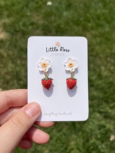 These cute strawberry earrings are great for fruit lovers or anyone who loves spring or summer! They are small enough to not get caught in longer hair but still make a big statement. The flowers and strawberries in these earrings are sculpted, baked, painted, and sanded completely by hand with the use of polymer clay. Feel free to message me with any questions or with your own custom idea! Earrings Strawberry, Strawberry Earrings, Longer Hair, Cute Strawberry, Earrings Polymer Clay, Flower Earrings, Polymer Clay Earrings, Clay Earrings, Jewelry Earrings Dangle