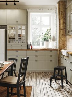 the kitchen is clean and ready to be used for cooking or dining, with wooden flooring