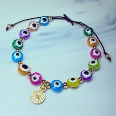 Mixed coloured evil eyes 🧿 adjustable cord  bracelet one size fits all Adjustable Cord Bracelet, Silver Elephants, Evil Eyes, Cord Bracelet, Cord Bracelets, Large Crystals, Beaded Rings, Elegant Earrings, Evil Eye