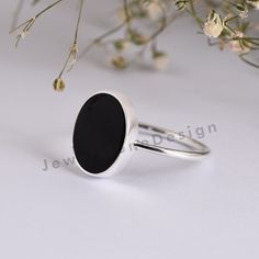 "Oval Black Ring, 925 Sterling Silver Ring, Ring with Flat Oval Stone, Genuine Onyx Gemstone, Silver Ring, Modern Ring, Minimalist Ring Item Made With Pure 925 Sterling Silver and Nickel, Cadmium Free. We accept customisation contact us For Custom orders. Product Detail : Metal : 925 Sterling Silver Gemstone : Black Onyx Item : Ring << About Black Onyx>> A powerful protection stone, Black Onyx absorbs and transforms negative energy, and helps to prevent the drain of personal energy. Minimalist Oval Onyx Jewelry, Silver Onyx Ring Fine Jewelry, Oval Black Onyx Jewelry, Oval Silver Onyx Jewelry, Oval Cabochon Onyx Ring Gift, Oval Stone, Modern Ring, Minimalist Rings, Black Rings