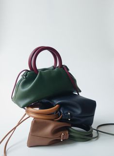 Introducing 'The Fawn' collection: Compact, lightweight, yet spacious with two contrasting colors for a unique character.  Ideal for those who seek style without bulk, it offers a minimalist solution for essentials. Crafted with Full-grain Italian Aniline leather, the finest grade of hides, ensuring durability. Aniline leather is renowned for its exceptional natural touch, distinctive patterns in each piece, and can develop a beautiful shine over time with use.  Specially designed hardware accents adorn both sides of the bag, enhancing its appeal with a blend of attractiveness, playfulness, and sophistication. The Fawn is versatile in its usage. It can be carried by the top handles, on the arm, over the shoulder, or as a crossbody, offering convenience for all your daily activities Each ba Satchel Box Bag With Handle Drop For Errands, Minimalist Satchel With Detachable Handle For Everyday, Minimalist Bag With Detachable Double Handle, Minimalist Everyday Satchel With Detachable Handle, Everyday Satchel-shaped Box Bag With Detachable Handle, Modern Crossbody Box Bag With Leather Handles, Minimalist Bags With Detachable Handle For Everyday, Crossbody Shoulder Bag With Handle Drop For Everyday Use, Everyday Satchel Box Bag With Detachable Handle