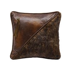 a brown and black animal print pillow on a white background