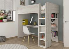 a loft bed with desk underneath it in a room