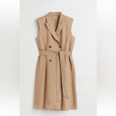 Fitted Sleeveless Jacket Dress In Woven Linen And Viscose Blend.Knee Length, Has Tie Belt, Pointed Lapels, Double Breasted Wrapover Front. Lined Elegant Spring Vest Dress, Chic Sleeveless Vest Dress For Spring, Chic Sleeveless Dress For Spring, Elegant Sleeveless Spring Outerwear, Beige Sleeveless Dress For Spring Workwear, Beige Sleeveless Dress For Work In Spring, Sleeveless Beige Outerwear For Work, Casual Sleeveless Dress For Fall Workwear, Chic Sleeveless Outerwear For Work