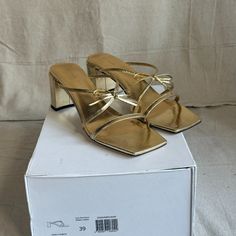 Never Worn By Far Gold Sandals. Sold Out Online (From What I Can See). Delicate And Lightweight With A Sturdy Heel. Size 39. Gold Sandals With Sculpted Block Heel, Gold Leather Mules For Spring, Spring Gold Sandals With Sculpted Heel, Gold Sandals With Sculpted Heel For Spring, Chic Gold Block Heel Sandals, Glamorous Leather Mules With Open Heel, Glamorous Leather Open Heel Mules, Summer Cocktail Mules With Sculpted Heel, Modern Gold Heels With Wrapped Heel