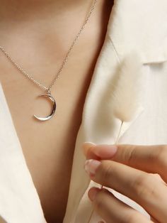 "Description * Crescent Moon Necklace * A petite crescent moon presides upon this sterling silver pendant necklace, simple but stunning. You can use it very comfortably in daily life and special days with a modern ad classical style. You will love to wear yourself or give as gift.  Material: 925 Sterling Silver Finish: 925 Sterling Silver Chain: 15.5\" Pendant Size: 15mm x 15mm  Package: All jewelry will arrive tastefully packaged making it a perfect gift. Category: Layered Necklace, New Moon Necklace, Moon Pendant Necklace, Moon Necklace Silver, Friendship Necklace, Gift For Her, Occasion Necklace, Occasion Jewelry O T H E R ∙ I N F O R M A T I O N ∙ All the chain will come with a 2\" extension to suit your preferences. ∙ Can't find your information? Please feel free to contact us ♡We are Elegant Moon Shaped Sterling Silver Charm Necklace, Elegant Sterling Silver Crescent Charm Necklace, Minimalist Sterling Silver Moon Phase Charm Necklaces, Minimalist Sterling Silver Moon Phase Charm Necklace, Minimalist Half Moon Sterling Silver Charm Necklace, Minimalist Sterling Silver Moon Necklace, Minimalist Sterling Silver Half Moon Charm Necklace, Silver Crescent Charm Necklace For Everyday Wear, Minimalist White Gold Moon Charm Necklace