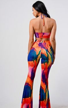 Wide leg pants with matching bikini top, with vibrant swirl detail True to size with stretch Bold Fitted Summer Pants, Fitted Multicolor Beach Pants, Fitted Multicolor Bottoms For Beach Season, Colorful Fitted Bottoms For Summer, Fitted Multicolor Pants For Beach, Fitted Colorful Bottoms For Summer, Fitted Multicolor Pants For The Beach, Fitted Multicolor Bottoms With Vibrant Print, Vibrant Multicolor Party Bottoms