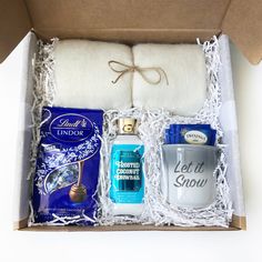 an open gift box containing personal care items