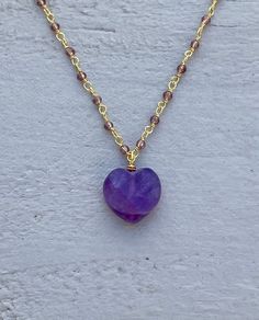 This necklace is handcrafted using a 2mm amethyst wire-wrapped chain and a 12mm faceted amethyst heart pendant. The amethyst is authentic and AAA quality. A gunmetal version is also available in my shop. Amethyst promotes peace, clarity and cleanses energy.  The necklace comes in a ribbon-wrapped box, ready to be gifted. If you would like to leave a note for the recipient, you can do so during checkout. Please note that each stone is unique and varies in color. Purple Amethyst Heart Necklaces, Purple Heart-shaped Amethyst Necklaces, Purple Amethyst Heart Necklace, Heart-shaped Amethyst Necklace For Valentine's Day, Purple Heart Amethyst Necklace, Amethyst Heart Charm Necklace As A Gift, Amethyst Heart Charm Necklace For Gift, Purple Amethyst Jewelry With Heart Charm, Amethyst Necklace With Heart Charm As Gift