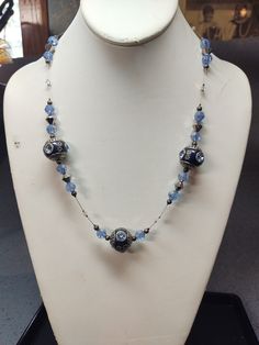 This necklace consist of silver sparkle and blue based glass faceted beads, navy polymer clay beads and silver tone metal. Silver Sparkle, Polymer Clay Beads, Clay Beads, Faceted Bead, Bleu Marine, Silver Tone, Polymer Clay, Beaded Necklace, Jewelry Necklaces