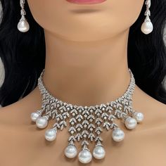 A timeless classic, the Beauvince Diamond & Pearl Vines Necklace is a fine balance of elegance and flamboyance. Gemstones Type: Pearl Gemstone Origin: South Sea Gemstones Shape: Drop Shape Gemstones Weight: 136.80 ctGemstones Color: White Diamonds Shape: Round Total Diamonds Weight: 19.26 ctDiamonds Color: H - I Diamonds Clarity: VS - SI (Very Slightly Included - Slightly Included) Metal: 18K White Gold Metal Wt: 78.93 gms Setting: Prong & Pave Set Length: 15 Inches Price Quoted may be negotiabl Diamond Jumkas, Teen Necklaces, Fine Pearl Jewelry, South Sea Pearl Necklace, Beef Empanadas, Diamond Jewelry Set, Art Jewelry Design, Pearl Jewelry Design, Big Necklace