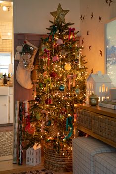 a decorated christmas tree in a living room