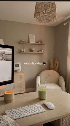 a computer monitor sitting on top of a wooden desk