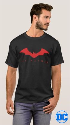 The Batman symbol and text graphic dark t-shirt. More colors and designs at the Batman store on Zazzle. Artwork designed by Batman™ Basic Black Ring-spun Cotton Top, Black Basic Ring-spun Cotton Top, Black Short Sleeve T-shirt In Ring-spun Cotton, Black Logo Print Tops In Ring-spun Cotton, Black Ring-spun Cotton Short Sleeve Top, Black Ring-spun Cotton Top With Logo Print, Black Short Sleeve Top In Ring-spun Cotton, Basic Black T-shirt For Fan Merchandise, Black Basic T-shirt For Fan Merchandise