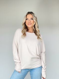 Stay warm and cozy in style with this luxurious Dolman Sleeve Top. Ultra soft and fuzzy fabric stretches to fit, allowing for ease of movement. The relaxed fit and rounded neckline make it perfect for layering and to elevate any basic outfit. Perfect for all occasions from a coffee run to a movie night by the fireplace. Experience comfort and exclusivity today. Self 95% Rayon 5% Spandex Machine wash cold. Beige Long Sleeve Cozy Fit Top, Beige Long Sleeve Tops With Cozy Fit, Cozy Soft-washed Solid Color Sweater, Super Soft Oversized Comfy Sweater, Oversized Super Soft Comfy Sweater, Oversized Soft Knit Chic Top, Comfy Oversized Super Soft Sweater, Chic Oversized Soft Knit Top, Oversized Comfy Super Soft Sweater