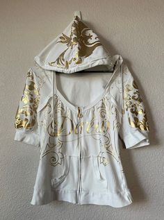 Beautiful cotton hoodie Two side pockets Gold floral pattern Material - 95% cotton 5% spandex Normal wear sign with ight stain on shoulder and right side of hoodie. Not noticeable Measurement - White Fitted Sweatshirt For Spring, Fitted White Sweatshirt For Spring, Spring White Fitted Sweatshirt, White Y2k Outerwear For Spring, White Y2k Spring Outerwear, White Cotton Y2k Outerwear, Y2k White Cotton Outerwear, Fitted White Hoodie Sweatshirt, White Fitted Hoodie Sweatshirt