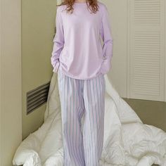 Discover comfort and style with Ever Lasting's Solid Long Sleeves and Striped Pants Pajama Set. Perfect for lounging at home or sleeping in luxury, this pajama set combines comfort and style to give you a restful night's sleep. With solid long sleeves and striped pants, it's a versatile set that offers both warmth and breathability. Whether you're unwinding after a long day or enjoying a leisurely weekend, this pajama set ensures both comfort and style. Features: 100% Grade A Cotton Unisex Style Hidden Pockets Relax Fit (stretchy waistband) Breathable (great for all seasons) Machine Safe General Size Guide: Size S/M -> Size 0 - 4 Size M/L-> Size 4 - 8 Size L/XL -> Size 8 - 12 Looking for more coziness? Shop our loungewear collection. Comfortable Pajama Party Sets With Long Pants, Comfortable Long Pants Sets For Pajama Party, Relaxed Fit Sleep Set With Long Pants, Casual Home Sets With Long Pants, Relaxed Fit Long Pants Set For Relaxation, Relaxed Fit Sets With Long Pants For Relaxation, Relaxed Fit Long Sleeve Loungewear Set, Casual Relaxed Fit Pant Set For Loungewear, Relaxed Fit Bedtime Sets With Long Pants