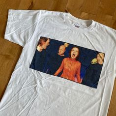 "This piece is a vintage t-shirt from the late 1990s for the American rock band, Garbage. This white tee has a big graphic on the front with an image of all the band members; Shirley Manson,  Duke Erikson, Steve Marker and Butch Vig. On the back is the URL for the bands website across the shoulders.  -100% Cotton -Single Stitch -No Major Stains, Yellowing, or Flaws Tag Size: Large, fits slightly smaller *refer to measurements for true fit* Pit to Pit: 20.5\" Length: 27.5\" Please also assess the White Y2k T-shirt For Concert, Y2k White T-shirt For Concert, Y2k Style White T-shirt For Concerts, White Custom Print Grunge T-shirt, Pop Culture White T-shirt For Concerts, White Pop Culture T-shirt For Concerts, White 90s T-shirt For Concert, American Vintage Clothing, Band Website