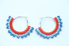 These hoop earrings are made using traditional freehand beading techniques. Earrings are made of quality Czech beads and strong thread. Stainless steel hoops. Earrings are 4.5 cm ( 1.8 inches)  length and 5 cm ( 2 inches) width. Colors: orange,red,blue. 100% handmade. Don't forget to check out my other hoop earrings in the store. Maybe you will find exactly what you are looking for. https://www.etsy.com/shop/SandasHandmades The photo may not convey true colors. This may depend on the settings of Festive Beaded Hoop Earrings With Round Beads, Festive Beaded Hoop Earrings, Small Hoop Beaded Earrings With Spacer Beads As Gift, Small Hoop Beaded Earrings With Spacer Beads For Gifts, Handmade Beaded Hoop Earrings Gift, Handmade Beaded Hoop Earrings For Gifts, Gift Dangle Hoop Earrings With Spacer Beads, Handmade Small Hoop Beaded Earrings For Summer, Handmade Hoop Earrings For Festive Occasions