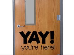 a door with the words yay you're here on it