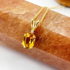 "Introducing our stunning Gold Citrine Pendant Necklace, a radiant piece that celebrates the beauty of November's birthstone. This necklace features a captivating 8x6mm natural Citrine gemstone, known for its warm yellow hues and vibrant energy. The Citrine is elegantly set in 10K yellow gold, exuding a luxurious and timeless appeal. A sparkling diamond adds a touch of brilliance to the pendant, creating a harmonious blend of sophistication and charm. Embrace the radiant energy of this November Jewellery Video, November Birthstone Necklace, Citrine Earrings Studs, Minimalist Necklace Gold, Radiant Energy, Yellow Hues, Citrine Jewelry, Citrine Pendant, Aquamarine Pendant