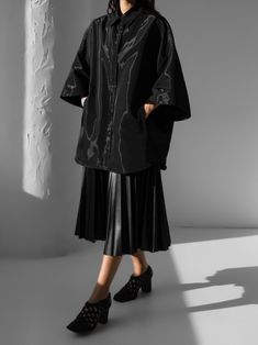 Oversized cape coat shirt in jacket style with half sleeve. Collared and button down front. Model is wearing MINUSEY ONE SIZE. ✔️ Free worldwide express shipping over $100✔️ Loved by 6,500+ customers✔️ Limited edition collections, maximum style⠀⠀⠀⠀⠀⠀⠀⠀⠀Stay ahead of the trend with can’t-find-anywhere-else staples. Your closet will thank you 💕 MINUSEY ONE SIZE = EU 34-38, US 2-6 100% Polyester Dry clean Made in Korea - Model Height: 172cm/5'7" (US 2, EU 34) Workwear Cape Outerwear With Button Closure, Workwear Cape With Button Closure, Black Oversized Collared Outerwear, Modern Workwear Cape Outerwear, Modern Cape Outerwear For Work, Modern Cape-style Workwear Outerwear, Elegant Oversized Long Sleeve Cape, Oversized Cape Outerwear For Spring, Black Cape-style Outerwear For Work