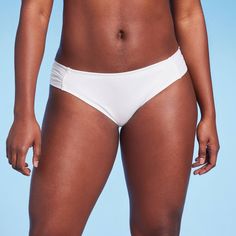 Hit the beach with confidence wearing this Soft Tabside Medium Coverage Bikini Bottom from Kona Sol™. This solid white bikini bottom features a low-rise design with medium-coverage, along with side tab details for chic flair. The stretchy fabric with a touch of spandex keeps you moving comfortably in and out of the water, while the full lining provides confident wear. Pair with a matching bikini top or with other bikini tops for endless styling options. Kona Sol™: Made for your day in the sun.