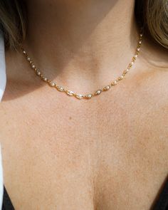 Our Pippa Pearl Choker is your new favorite choker! What do we love about it? The tiny pearl accents add just a touch of traditional style in a modern way! This choker is perfect for any bridal event but can also be worn any time of the year or for any occasion which makes this the perfect gift! FEATURES Choice of Materials: Brass, Choice of Yellow Gold or Rhodium Plating Faux pearl accents Dimensions: 16" with a 2" extender