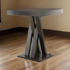 a table that is on top of a hard wood floor in a room with hardwood floors