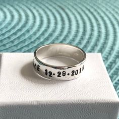 Sterling silver memorial ring personalized with a name, date of passing, inspirational phrase- perfect remembrance gift for men and women to honor a loved one. - Sterling silver, hand stamped band measures 6mm. - Personalize with up to 30 characters. -Hand stamped rings will stretch slightly when stamped, so more letters = more stretching. HOW TO ORDER: 1. Select Your Drop Downs. 2. Add to cart. 3. Leave me a note in the message to seller during checkout with your personalization up to 30 charac Silver Promise Jewelry With Names, Sterling Silver Rings With Names For Anniversary, Personalized Silver Engraved Ring For Mother's Day, Personalized Classic Birthstone Ring As Gift, Engraved Name Ring For Anniversary And Mother's Day, Personalized Promise Birthstone Ring For Mother's Day, Sterling Silver Engraved Name Ring For Anniversary, Personalized Round Birthstone Promise Ring, Personalized Silver Rings For Anniversary