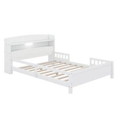 the bed frame is white and has no headboard or foot board, but it's made out of wood