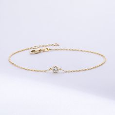 Solitaire Diamond Bracelet in 14K or 18K solid Gold, Bezel Set Dainty Diamond by the Yard Bracelet, Minimalist Bracelet Gift for Women, Graduation Gifts, Gift For Valentine, Gift For Birthday, Gift For Bridesmaid, Wedding Gift For Her ► Adding a customized tiny bar at clasp may be a good idea: https://etsy.me/3cn9OQ5 Material: Solid Gold, real gold (not gold plated or gold filled material) Karat: 14K (585), 18K (750) Gemstone: Genuine Diamond Available diamond options (size mm - weight ct): 1.80 Minimalist 14k Gold Diamond Bracelet With Bezel Setting, Delicate Gold Diamond Bracelet With Bezel Setting, Elegant 14k Gold Bracelet With Birthstone, 14k Gold Bracelet With Bezel Setting, Timeless 14k Gold Bracelets With Bezel Setting, 14k Gold Dainty Bezel Set Bracelet, Timeless 14k Gold Bracelet With Bezel Setting, Classic Gold Bracelet With Birthstone, 14k Yellow Gold Chain Bracelet With Bezel Setting