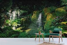 a chair and table in front of a wall mural with a waterfall on the side