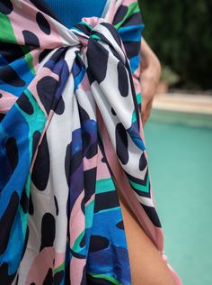 Meet the Melanie Pareo, your go-to layer for beach days and poolside lounging. Generously sized and crafted from soft, breathable rayon, it’s easy to tie and re-tie as you move from sun to shade. Wear it as a sarong skirt, knot it as a chic cover-up, or wrap it around your waist—this versatile pareo is designed for wherever the day takes you. Finished with tassel trim for a touch of movement, it’s a must-have for every woman who’s in and out of the water and always on the go.Pairs perfectly with Beachy Tied Swimwear For Summer, Tied Swimwear For Summer, Summer Beach Swimwear With Tied Details, Summer Tied Swimwear For Beach Party, Tied Swimwear For Summer Vacation, Summer Pool Swimwear With Tied Details, Beachy Summer Swimwear With Tie Waist, Tied Swimwear For Pool In Summer, Beachy Swimwear With Tie Waist For Summer