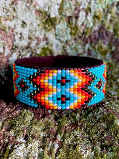 "Turquoise Red Aztec Style Beaded Brown Leather Stitched Cuff Bracelet Gift for her One Size Fits All Made using genuine Guatemalan leather and exquisite glass beads, this cuff bracelet gives off an elegant and luxurious feel. Its unique patterns are brilliantly colored with strong Native American influences. Every piece in our collection is hand stitched with impeccable precision and detail. They are designed to make you feel bold and empowered! Flexible cuff fits all-sized adult wrists Band wi Turquoise Accessories, Western Aztec, Aztec Style, Aztec Fashion, Hippie Bracelets, Leather Cuff Bracelet, Beaded Cuff Bracelet, Bead Weaving Patterns, Turquoise Leather