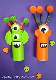 two paper dolls made to look like monsters