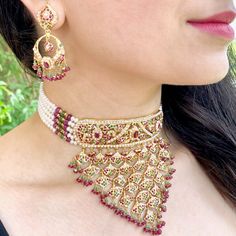 Featured is a traditional bridal choker set, ideally suited for bridal functions. The necklace weighs 69.2 gms including 19.68 gms in the hanging and stringing beads The earrings weigh 15.57 gms including 2.36 gms in the hanging ruby emerald beads. Price Breakup Summary Component Rupees % of Total 22k Gold 375,365 76.0% Stones & Beads 36,394 7.4% Making Charges 67,566 13.7% Taxes (GST) 14,380 3.0% Total 493,704 100.0% View Detailed Price Breakup Watch Video Here Ceremonial 22k Gold Meenakari Jewelry, Yellow Gold Meenakari Jewelry For Ceremonial Use, Yellow Gold Meenakari Jewelry For Ceremonial Occasions, Ceremonial Yellow Gold Jewelry With Meenakari, Ceremonial Yellow Gold Kundan Necklace With Meenakari, Ceremonial Kundan Meenakari Necklace In Yellow Gold, Traditional 22k Gold Meenakari Jewelry, Yellow Gold Round Bridal Necklace With Meenakari, Festive Temple Jewelry Bridal Choker Necklace