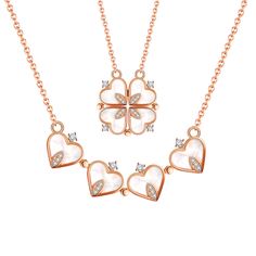 three heart shaped necklaces with cubicles and diamonds on the bottom, set in rose gold