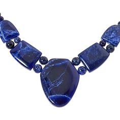 Jay King Sterling Silver Blue Sodalite 18" Necklace Bring out the blue in your eyes or a favorite outfit when you accessorize with this handcrafted, blue sodalite necklace. From Jay King.       Approx. 18"L x 1/4"W with 2-3/4" extender     Drop approx. 1-11/16"L x 1-5/16"W     Stamped .925     Hook closure     Blue sodalite necklace has drape comprised of large, freeform stone flanked by four smaller freeform stones separated by round beads     Round sodalite beads complete necklace   Stone Information       All sizes and weights approximate     Stabilized Blue Sodalite - Freeform (16x20mm to 34x44mm), round (6-8mm); mined in South Africa Sodalite Necklace, Jewelry King, Necklace Stone, Blue Sodalite, Beading Wire, Silver Blue, Stone Necklace, Round Beads, South Africa