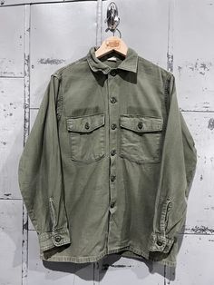 70's OG-107 Fatigue Button Up Shirt- Vietnam War(Army Green)  Fair vintage condition. See pictures for condition 15.5x33 . Please review measurements as some vintage items fit smaller than modern sizing. Measurements taken with garment laid flat: 21" across from armpit to armpit 27" length from shoulder to hem 23" sleeve from shoulder to hem Please send a message if you have any questions. Double check measurements and inspect all pictures carefully before purchasing. Orders ship via USPS. All s Mens Oxfords, Button Up Shirt, Up Shirt, Army Green, Button Downs, Button Up Shirts, Vietnam, Button Up, Oxford